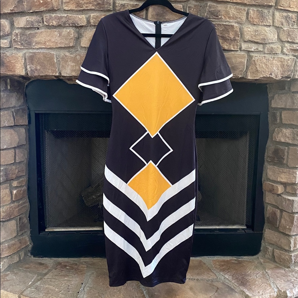 NWOT Geometric Black and Yellow Dress with ruffled sleeves. Size Medium